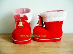 red plastic Christmas boots with bell and bow 