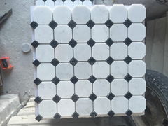 Black and white marble mosaic floor tiles