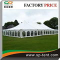 12x24m Pole Tent with Windows and Sides Secured to Grass Ground by Pegs and Rope