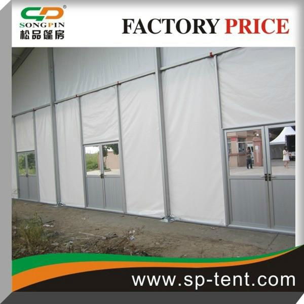 12x24m Pole Tent with Windows and Sides Secured to Grass Ground by Pegs and Rope 2