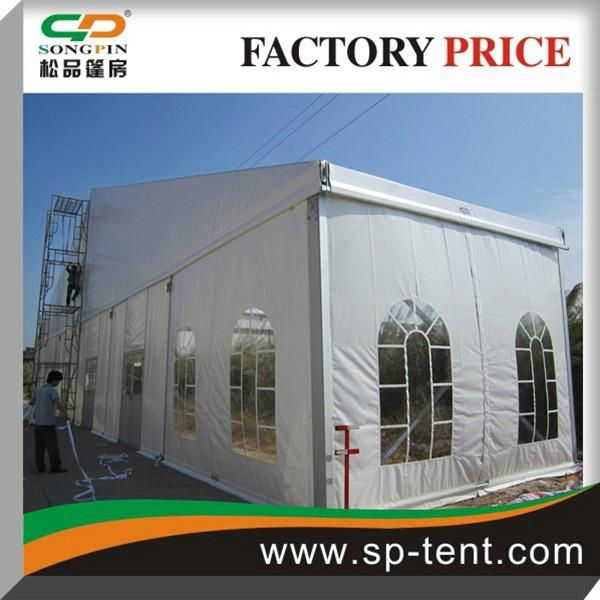 12x24m Pole Tent with Windows and Sides Secured to Grass Ground by Pegs and Rope 5