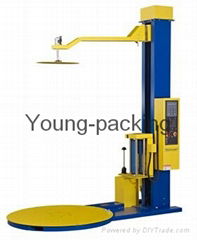 Pallet wrapping machine with top press