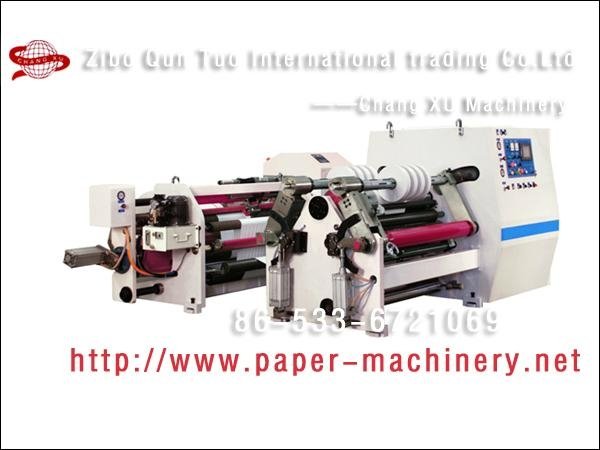 Two axis center surface cutting rewinding machine