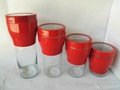 Red torch-shaped Glass Canister with stainless steel Set S/4 2