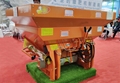 Tractor mounted fertilizer spreader