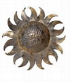 Applique sun realized in wrought metal