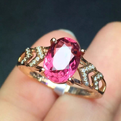 Classical natural pink tourmalines 18k gold ring set with diamonds.