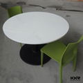 Black round solid surface dining table