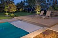 Automatic hard swimming pool cover above