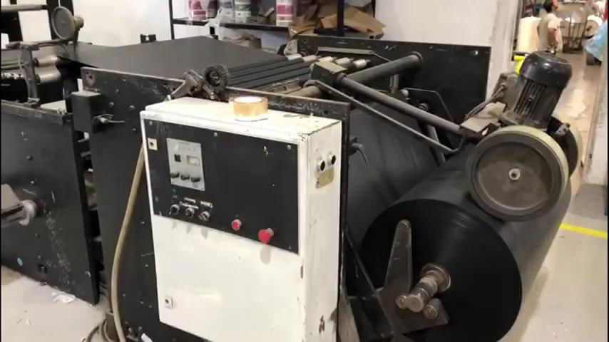 Garbage bag making machine with draw tape