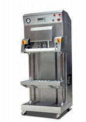 Vertical vacuum packaging machine