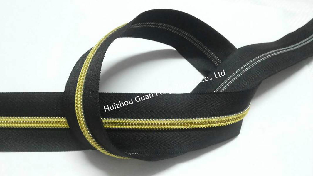 10# man pattern nylon zipper with black tape and golden teeth 2