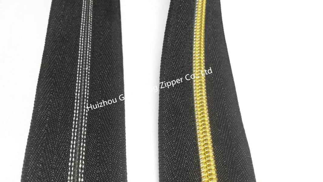 10# man pattern nylon zipper with black tape and golden teeth 3