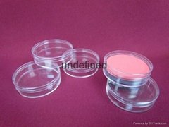 Cosmetic facial puff in hard plastic round clear case
