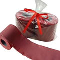 brown red colored toilet paper roll