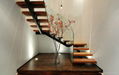 Contemporary wood staircase with glass railing