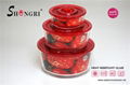 round glass food storage container red