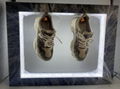 customize logo magnetic levitation rotating shoe advertisment display rack  1