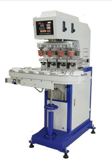 Pad printing machine with conveyor table