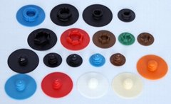 Plastic buttons for quick change disc