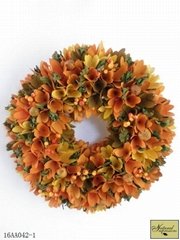 Orange wood curl and berries wreath