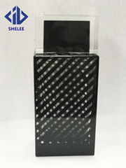 Black glass perfume bottle with plastic cap