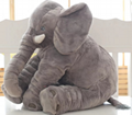 A pillow stuffed with a cartoon elephant