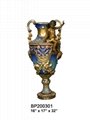 A Colorful Bronze Vase With Cherub