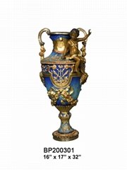 A Colorful Bronze Vase With Cherub