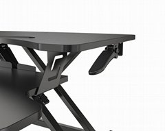 Sit to stand height adjustable desk
