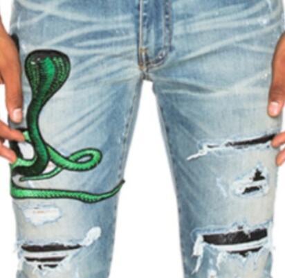 Amiri snake patch embroidered skinny jeans 