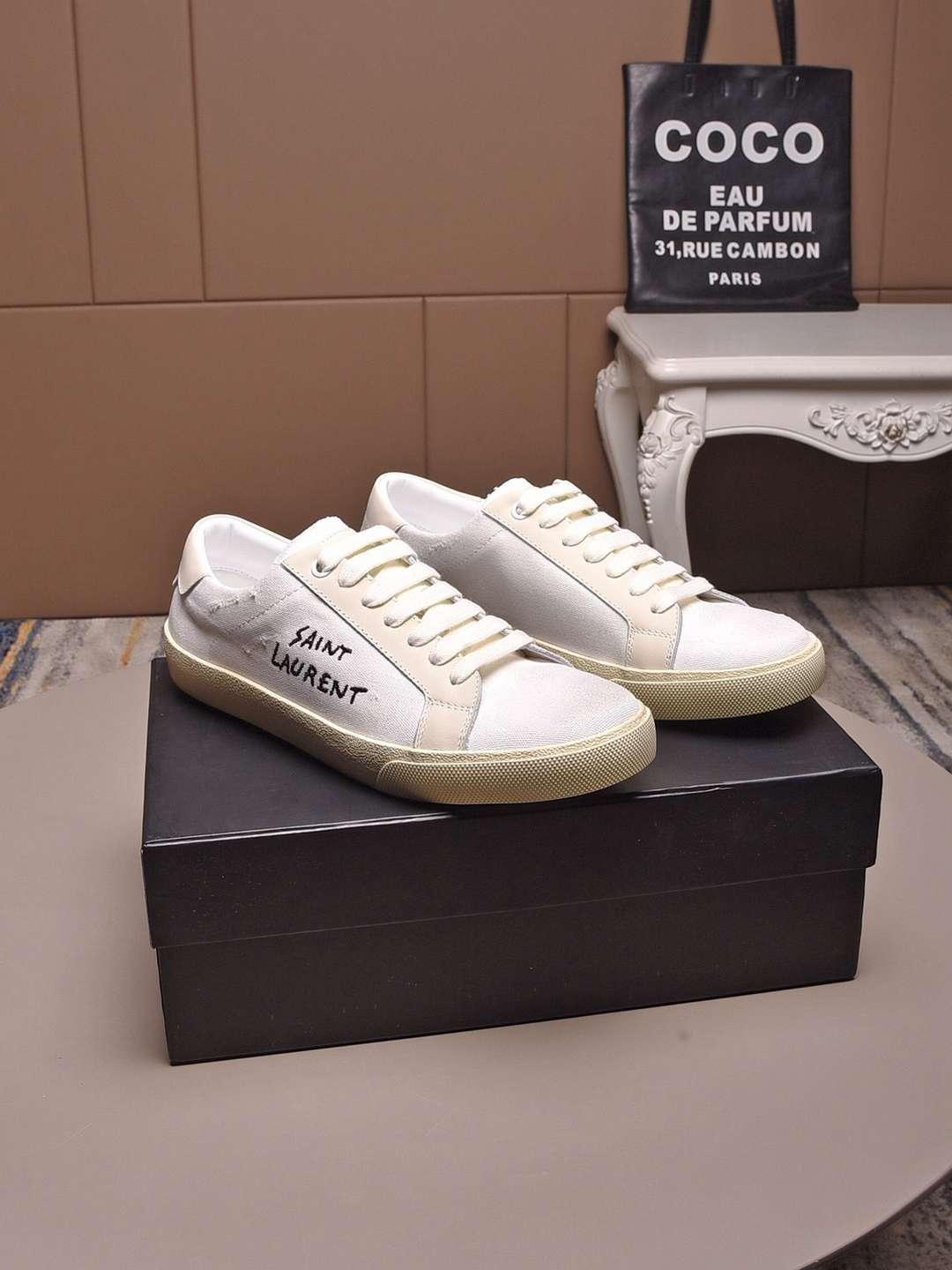 SAINT LAURENT Court Classic distressed logo embroidered canvas and leather shoes