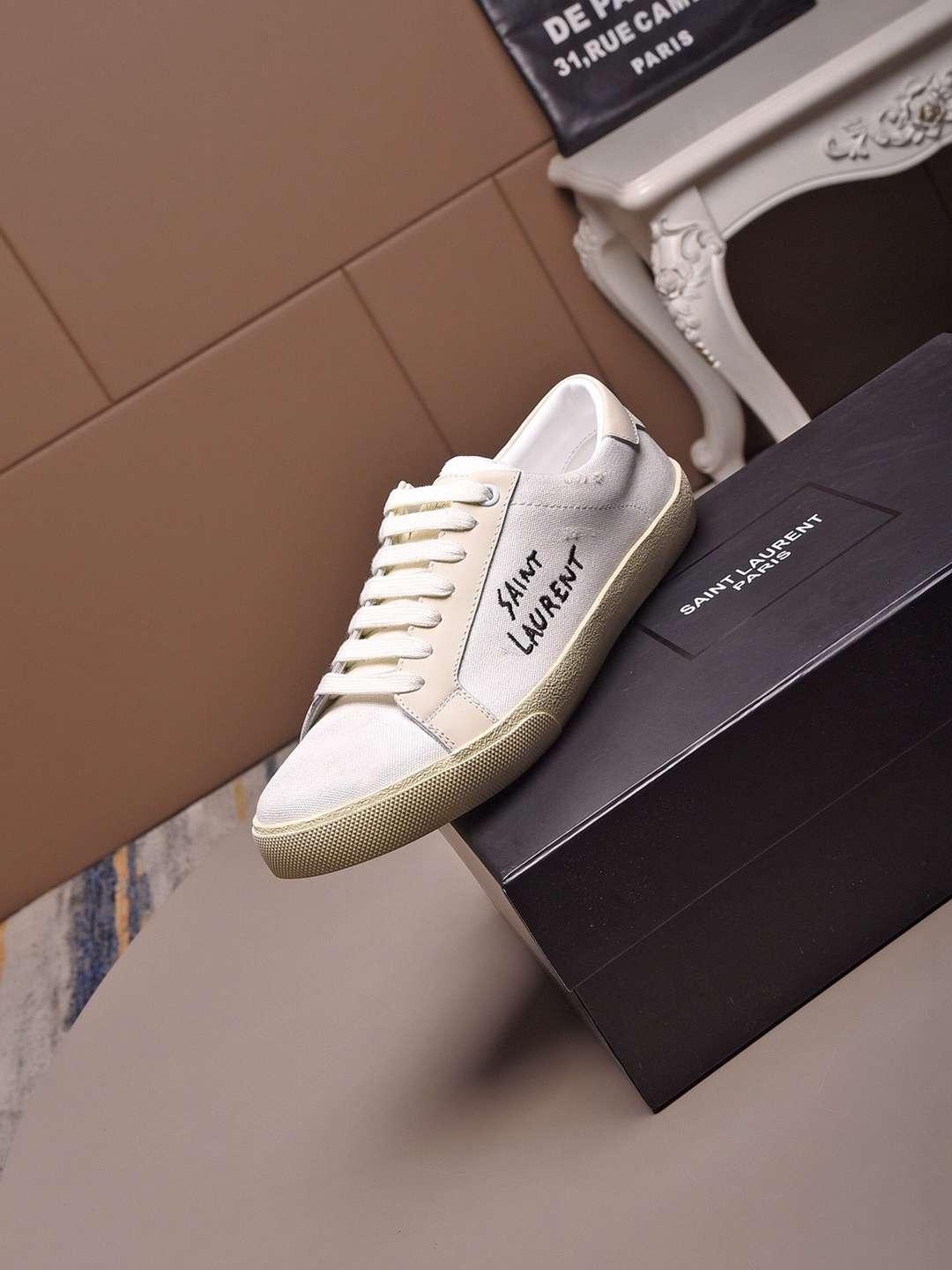 SAINT LAURENT Court Classic distressed logo embroidered canvas and leather shoes