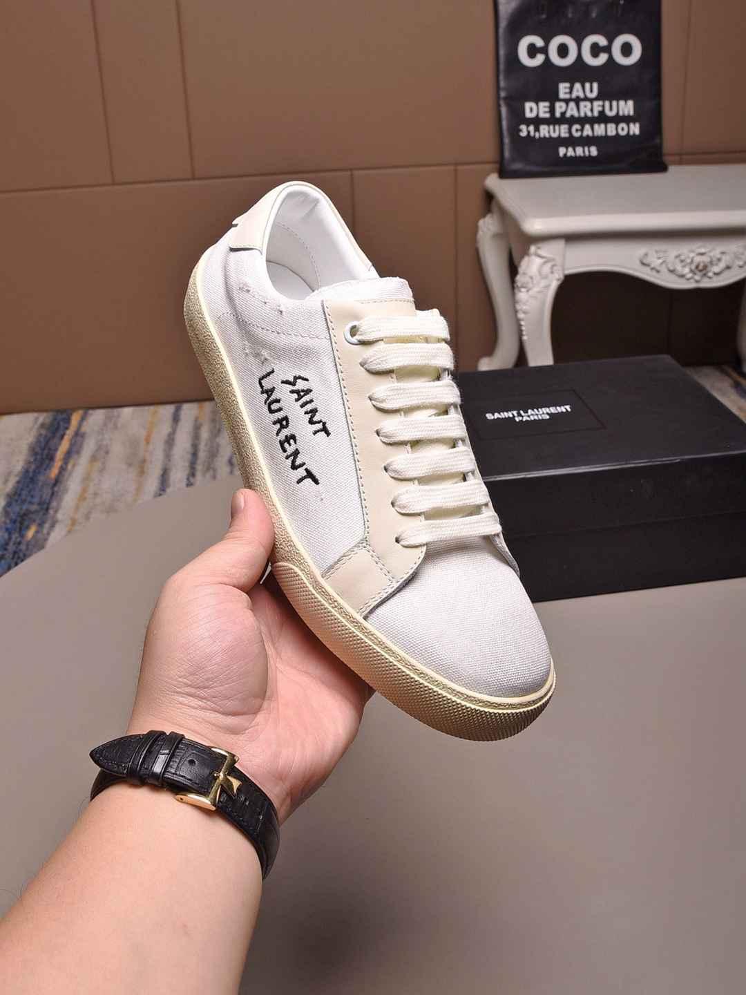 SAINT LAURENT Court Classic distressed logo embroidered canvas and leather shoes