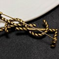 Saint Laurent YSL textured brooch Women Gold brooch