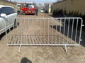 Temporary fence with concrete filled plastic feet and clamps 4