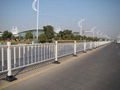 Temporary fence with concrete filled plastic feet and clamps 5