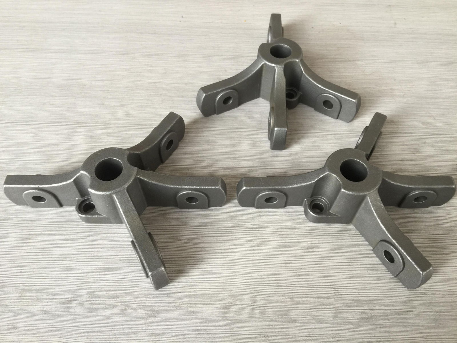 Investment casting support for agricultural machinery