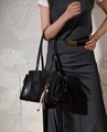 Female full-grain vegetable-tanned leather handbag