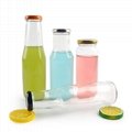 Empty clear glass tomato sauce beverage juice bottles with sealed metal cap