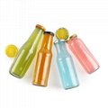 Empty clear glass tomato sauce beverage juice bottles with sealed metal cap