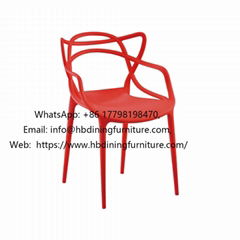 One-piece red plastic dining chair