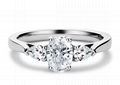 Main oval cut and two pear cut diamond ring