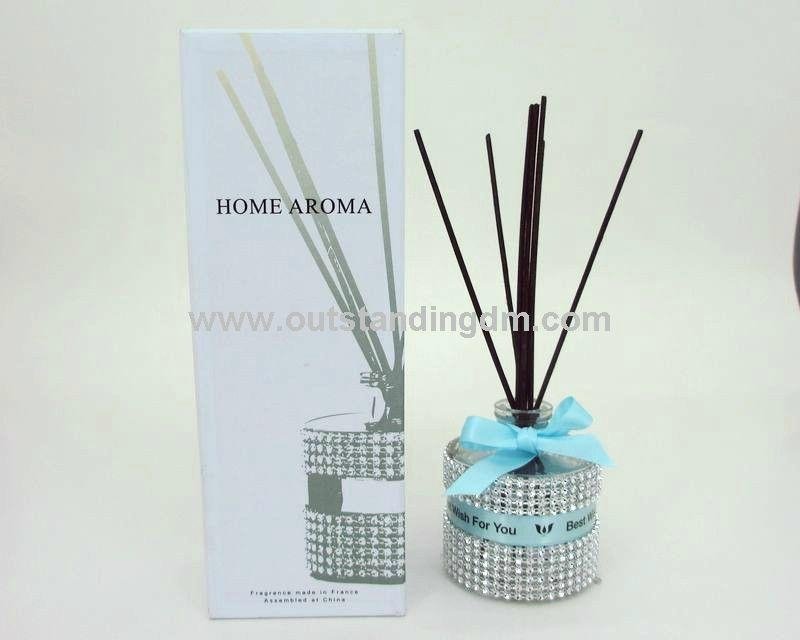 glass bottle with decoration and  ribbon, reed with flower ribbon