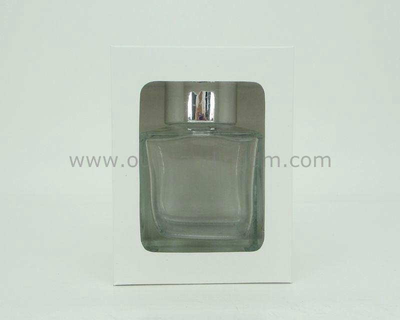 clear glass bottle with  silver ceramic cap 