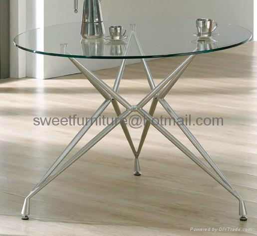 Round glass table with four chairs top