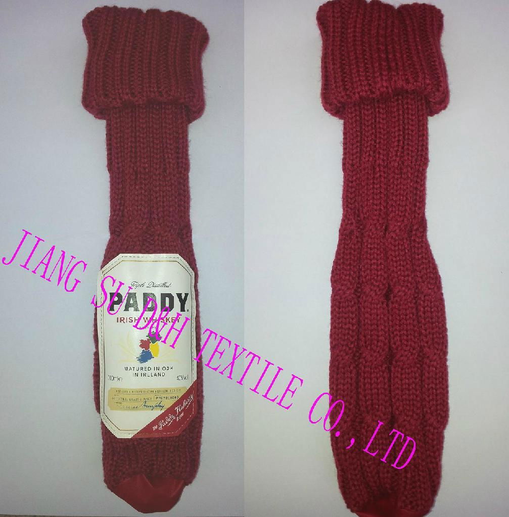 Knitted wine bottle cover with leather logo