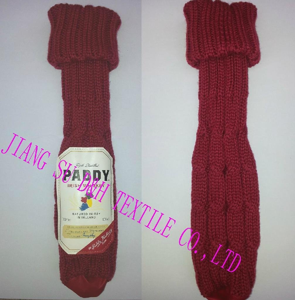 Knitted wine bottle cover with leather logo