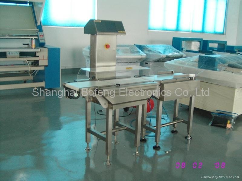 Check Weigher with Arm Type Rejection System