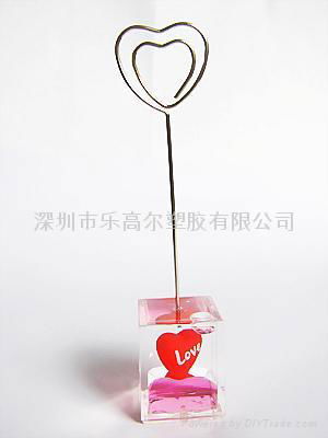 Advertise clip holder with heart floater inside